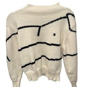 Elegant Cream Turtleneck Sweater with Black Detailing